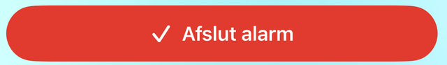 Den røde knap "Afslut alarm" med et flueben.